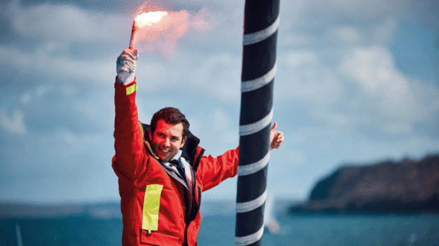 Guirec Soudée holding a flare