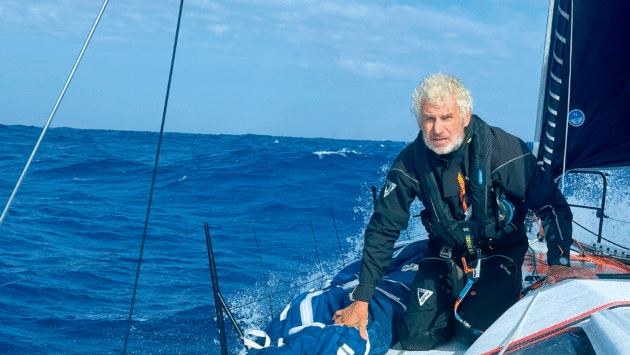 Man staring out to sea on a yacht