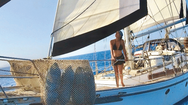 Rebels with Elena standing on deck