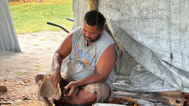 A traditional drum carved from the local ironbark wood