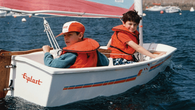 a young Alexis Loison skippering a homemade boat