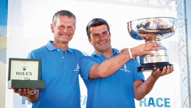 Prizegiving after winning the 2013 Rolex Fastnet Race overall with his father Pascal