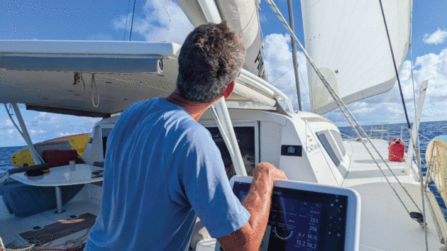 Jim keeping an eye on the trim and horizon while on passage.