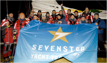 Ambersail, from Lithuania celebrate their arrival in Cowes after the finish of the Sevenstar Round Britain and Ireland Race.
