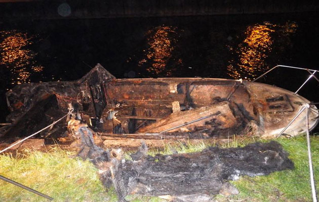 Burnt out cruiser on the River Lea