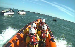 Classic wooden powerboat on fire