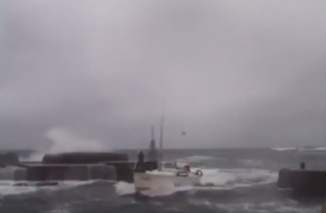 boat trying to reach bornholm harbour in rough seas