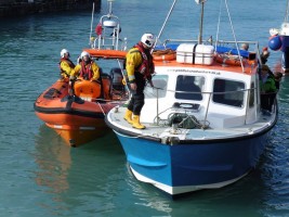 Newquay RNLI rescues the crew and passengers of the commerical fishing boat, which hit a submerged object off Newquay