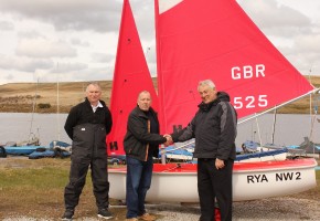 The new disabled access boat is handed over to Bolton Sailing Club. Left to right Warren Price (RYA Sailability North Development Officer), Keith Roberts (President Bolton SC), Michael Moore (Chairman RYA North West Region)