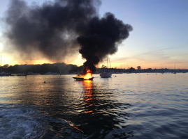 The boat on fire at Warsash Harbour on the River Hamble