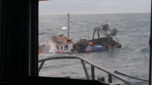 Two fishermen were rescued after their boat sank in the Atlantic