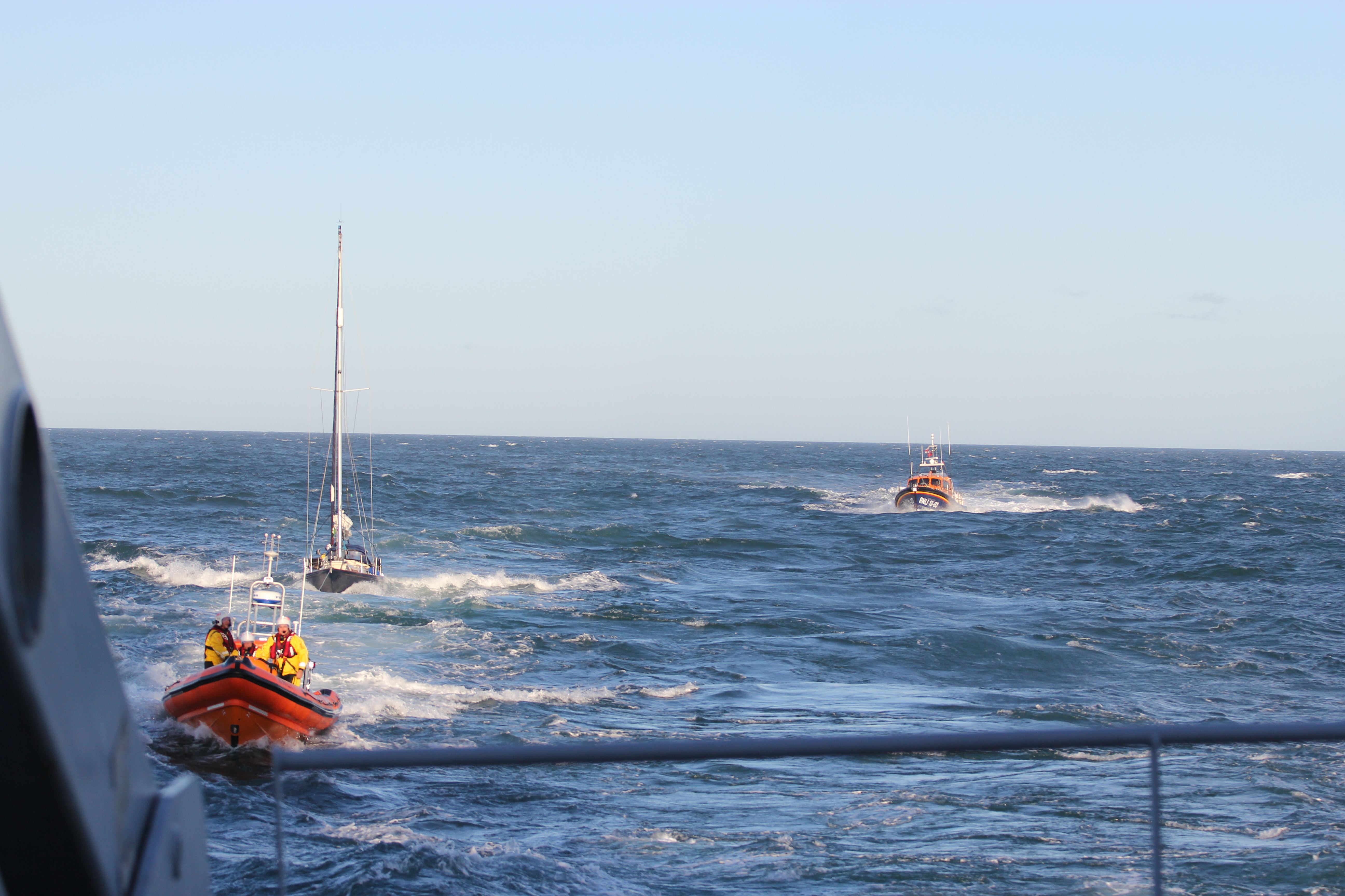 Teignmouth and Exmouth lifeboats with casualty yacht. Assisted by HMS Echo