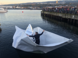 Frank Bôlter sets sail on his paper boat in Galway, Ireland