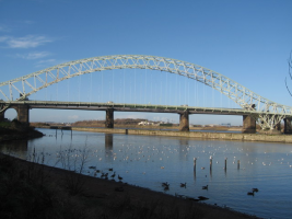 Silver Jubilee Bridge or Runcorn Bridge crosses the River Mersey and the Manchester Ship Cana