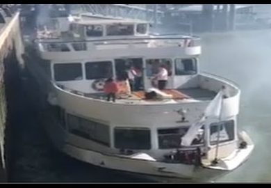 Erasmus - a commercial passenger boat - hits a riverside wall on the River Thames