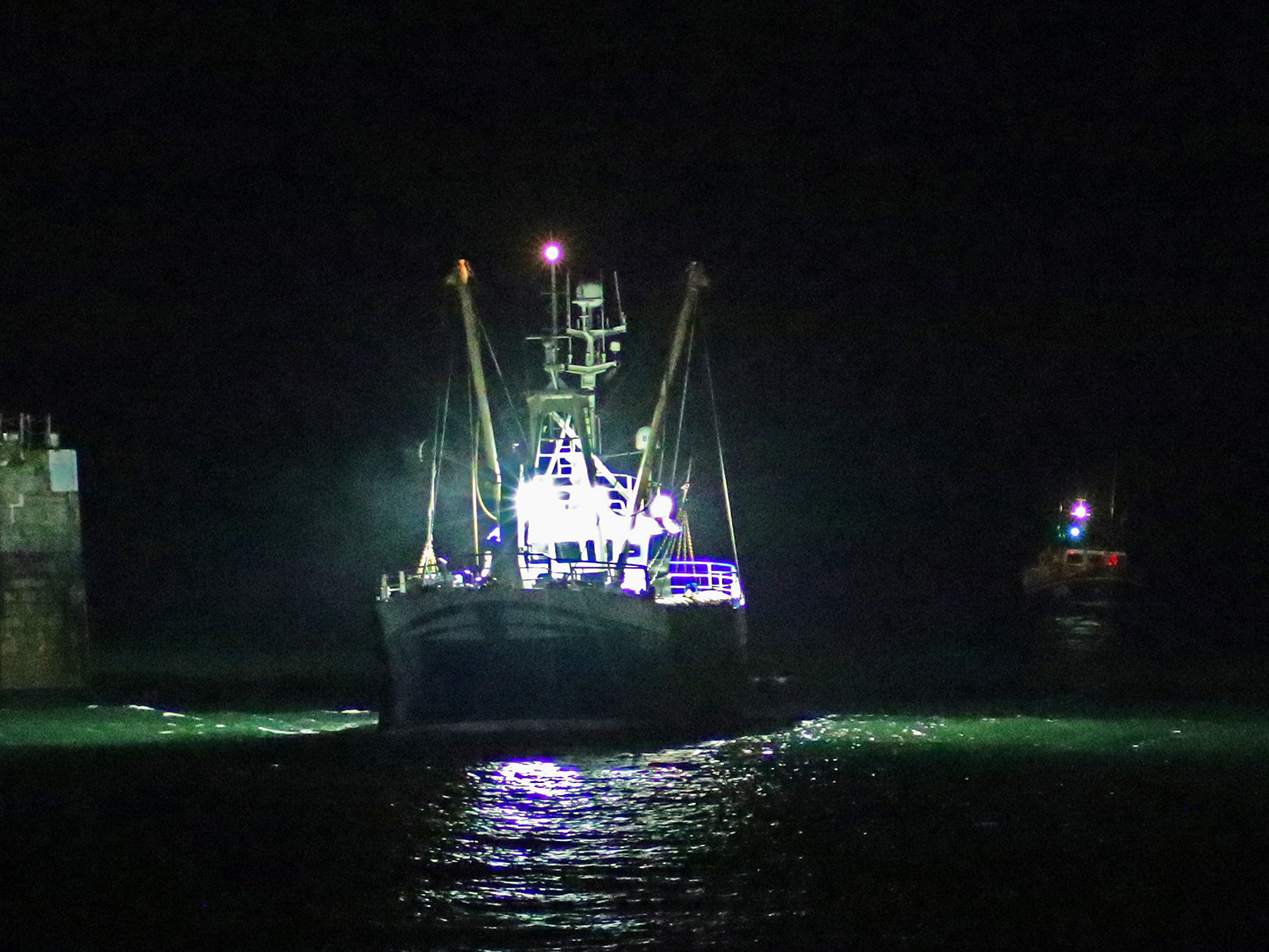 Douglas lifeboat Sir William Hillary escorts the fishing boat into Douglas Harbour. The skipper had DSC radio on board