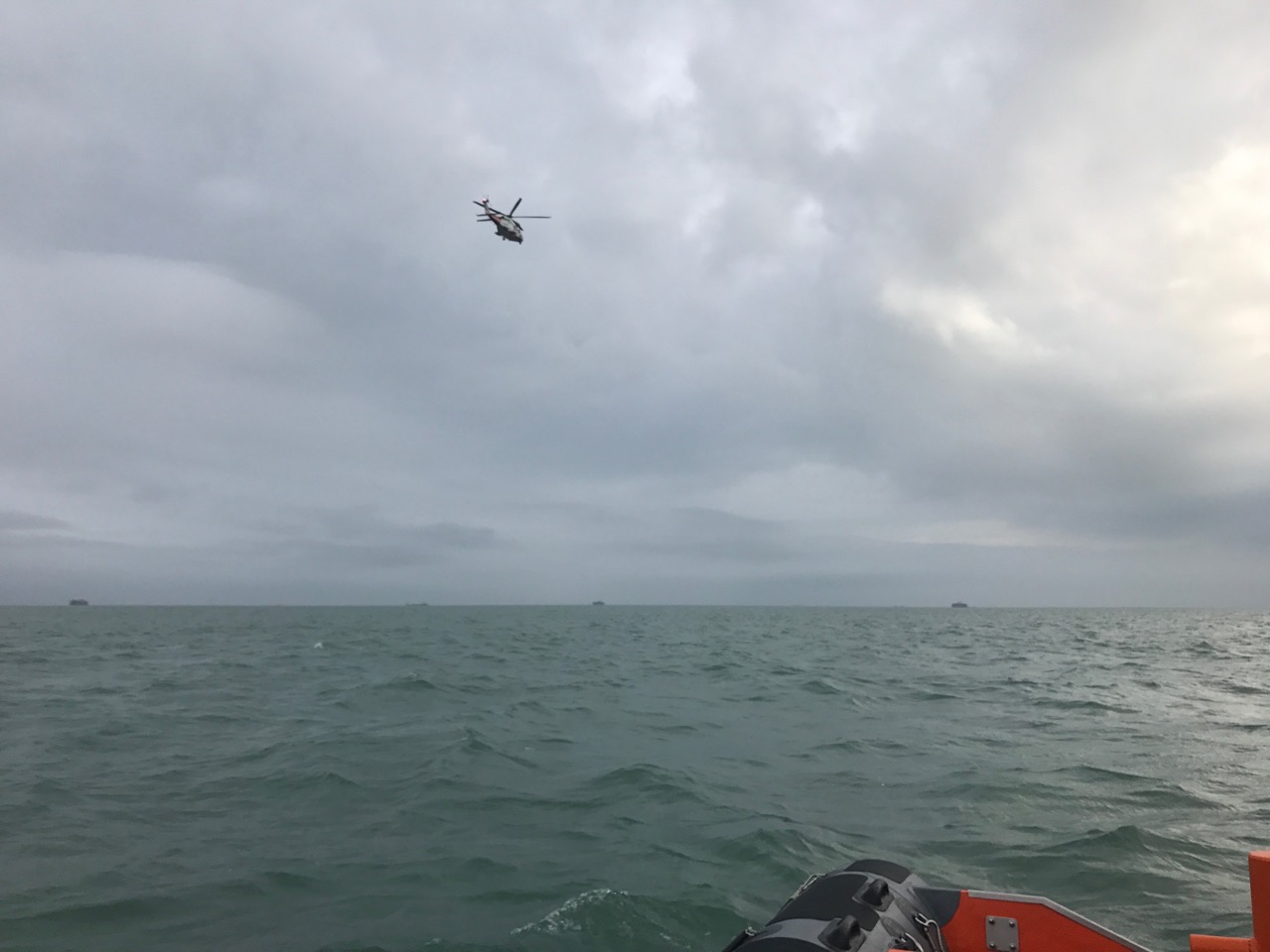 The Coastguard Rescue Helicopter from Lee-on-the-Solent searches the eastern Solent.