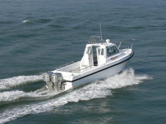 A white fishing boat on the water
