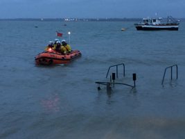 Calshot RNLI inshore lifeboat out on a shout to a girl stuck in mud