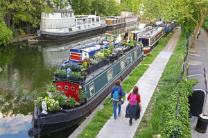 Narrowboats moored on a river in London