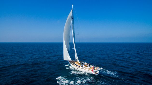A blue water cruising yacht at full sail