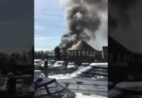 A motor yacht on fire at Burton Waters marina in Lincolnshire