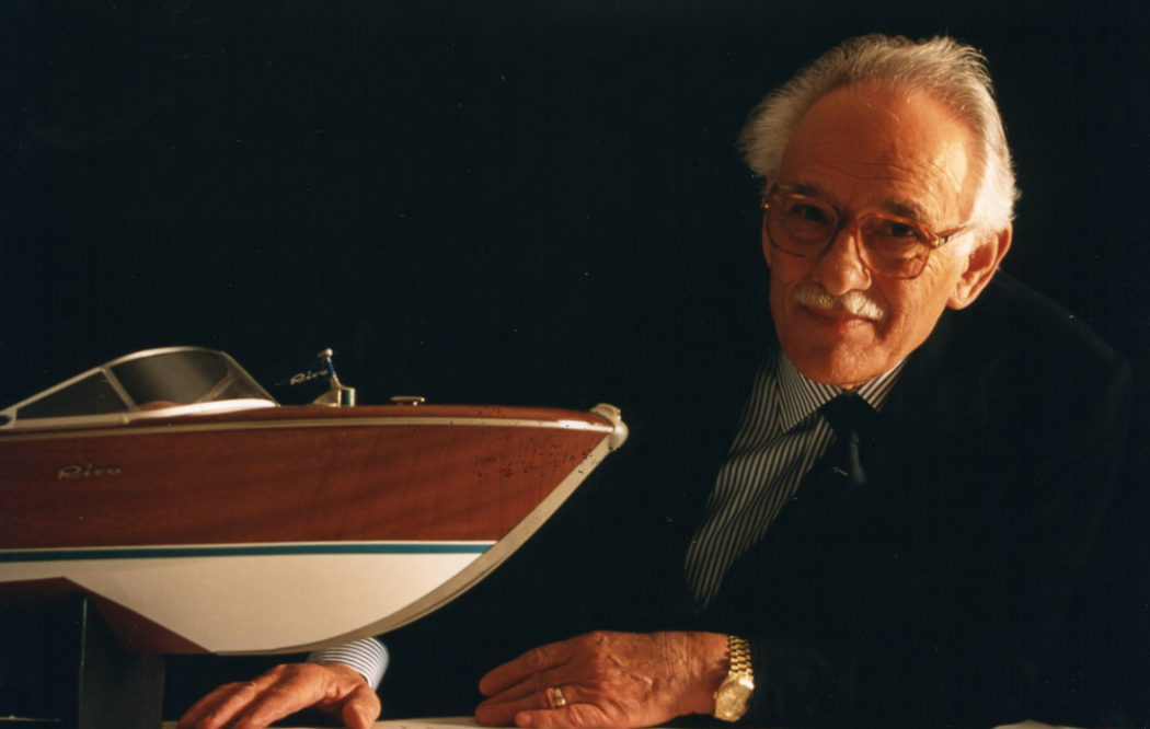 carlo riva with the model of a boat