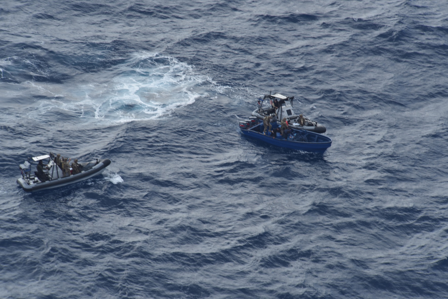 Navy RHIBS approach a suspect boat carrying cocaine