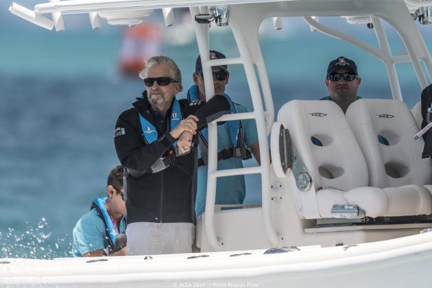 Hollywood actor Michael Douglas dressed in a dark top and wearing a life jacket on a boat