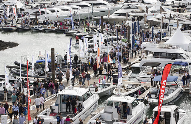 People walking among the boats at the Southampton Boat Show