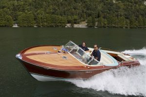 A wooden Riva boat out on the water