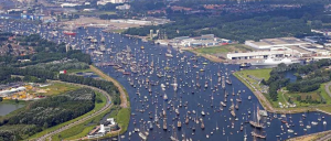 A parade of sail along a river