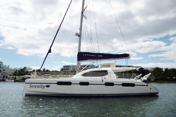 A catamaran at anchor...boat names