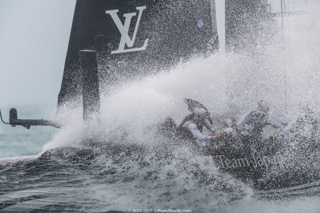 White water hits the deck of an America's Cup catamaran