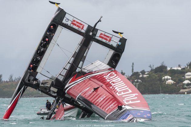 A red and black racing catamaran capsized in Bermuda
