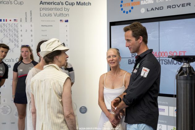 Dressed in white, Princess Anne meets Sir Ben Ainslie