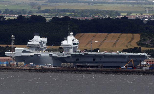 A large grey aircraft carrier HMS Queen Elizabeth