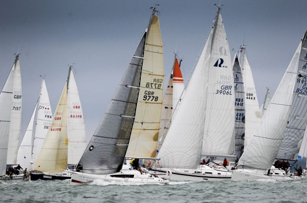 yachts in full sail at the start of the Round the Island Race on the Isle of Wight