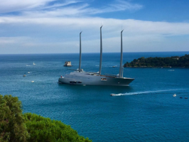 Sailing Yacht A arriving in a blue bay