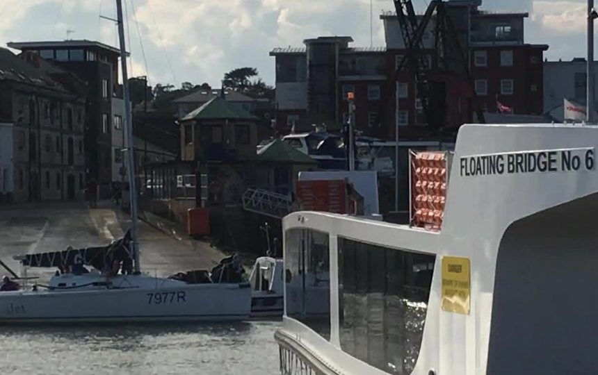 A boast is assisted by the harbour master after becoming caught up in the chains of the Floating Bridge