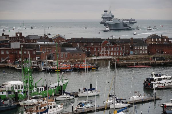 A warship enters the port of Portsmouth