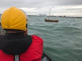 Wooden boat floating off Portsmouth Harbour