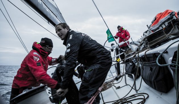 Crew grind on board a Volvo Ocean Race yacht