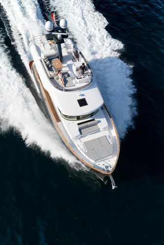A luxury motor yacht with a family on board