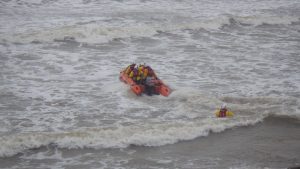 an inshore lifeboat from Port Talbot is launched in heavy seas