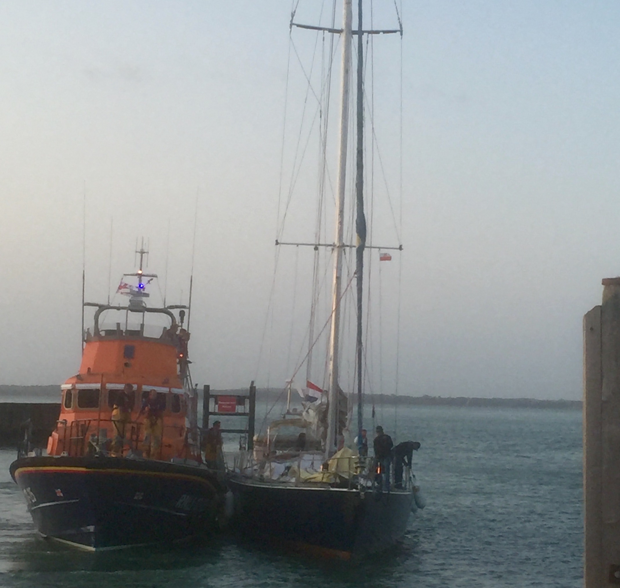 An all weather lifeboat helps the former BT Global Challenge yacht, Elinca