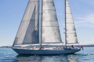 A large sailing yacht with white sails which used to belong to Pink Floyd drummer