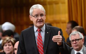 Minister of Transport Marc Garneau stands during question period in the house of commons