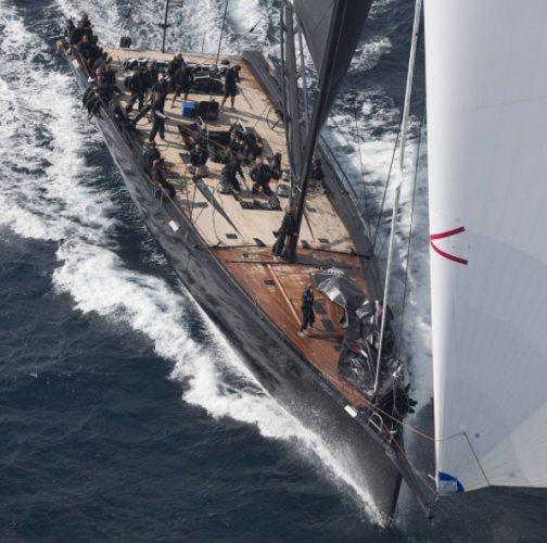 A Wally yacht with crew on board taking part in a regatta