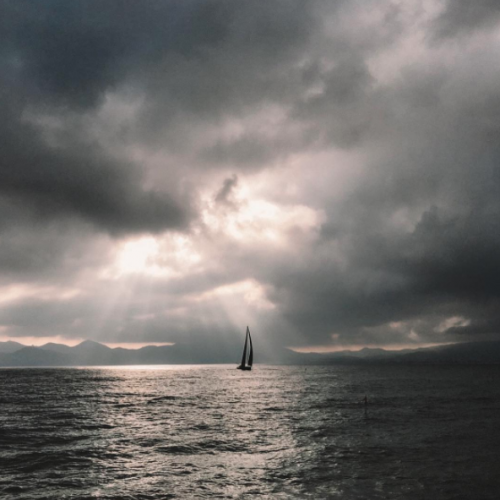 A yacht sailing into the distance